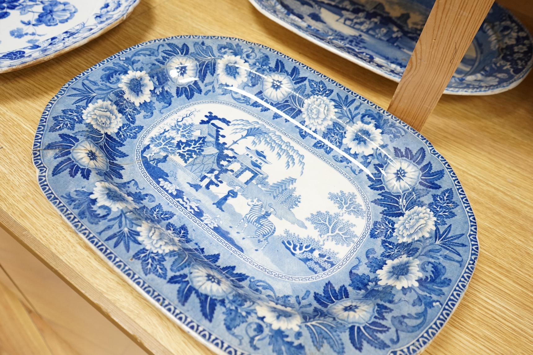 Six 19th century blue and white stoneware meat dishes to include Roger’s Staffordshire zebra pattern, largest 50cm wide. Condition - varies